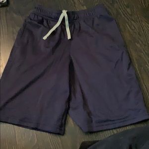 Navy blue athletic Champion shorts.